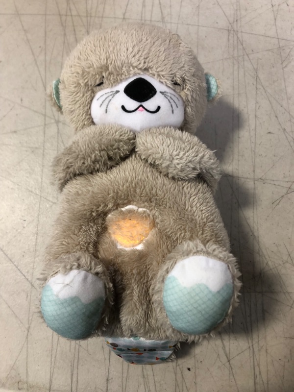 Photo 4 of Fisher-Price Play Snuggle Otter plush sound machine plays 30 mins of gentle music and sounds with a light and calming breathing motion