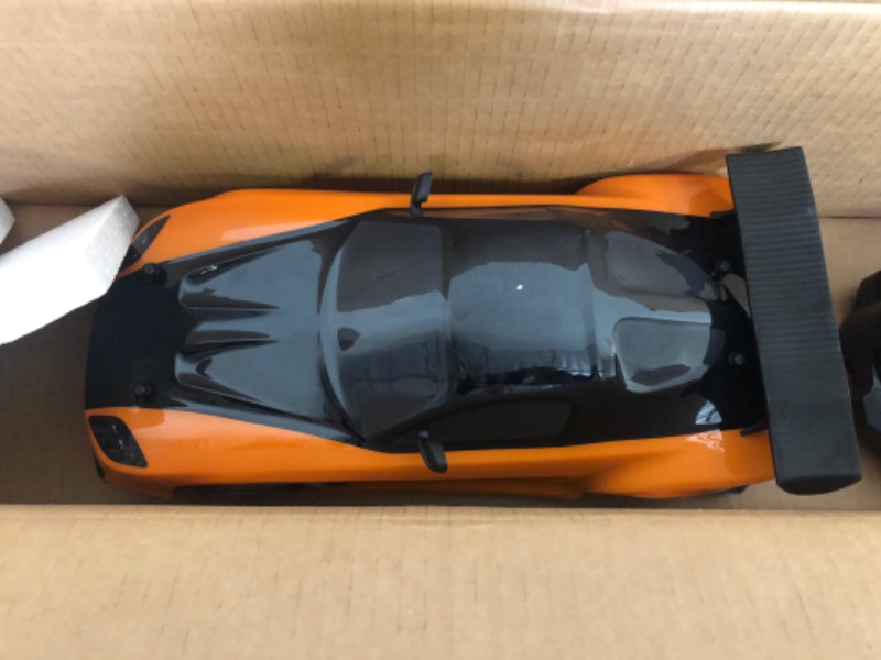 Photo 3 of Jada Toys Fast & Furious Han’s Mazda RX-7 Drift RC Car, 1: 10 Scale 2.4Ghz Remote Control Orange & Black, Ready to Run, USB Charging (Standard) (99700)