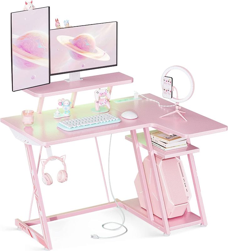 Photo 1 of MOTPK Pink Gaming Desk with LED Lights, Small Corner Desk with Storage Shelf & Power Outlets, Small L Shaped Desk with Monitor Shelf, Computer Desk with Carbon Fiber Texture, Gifts for Women & Girls
