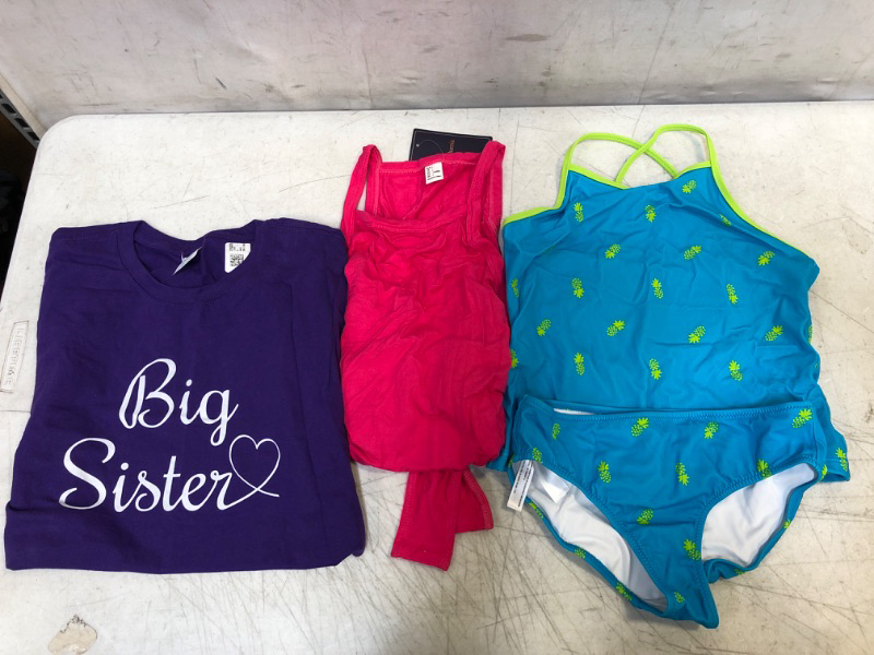 Photo 1 of GIRLS SUMMER CLOTHES: T-SHIRT S; ONESIE L; SWIMSUIT SIZE UNKNOWN