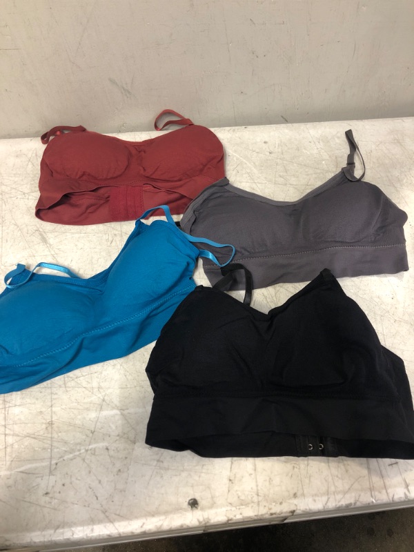 Photo 1 of FOUR PACK WOMENS SPORTS BRA SIZE MEDIUM VARIOUS COLORS 