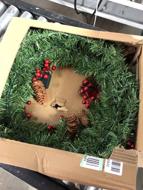 Photo 1 of 24" Artificial Christmas Bow Wreath with 15” Hanger, 50 LED Lights, Red Berries, Pine Cones & Pine Needles for Front Door, Windows, Living Room, and Indoor and Outdoor Christmas Decorations