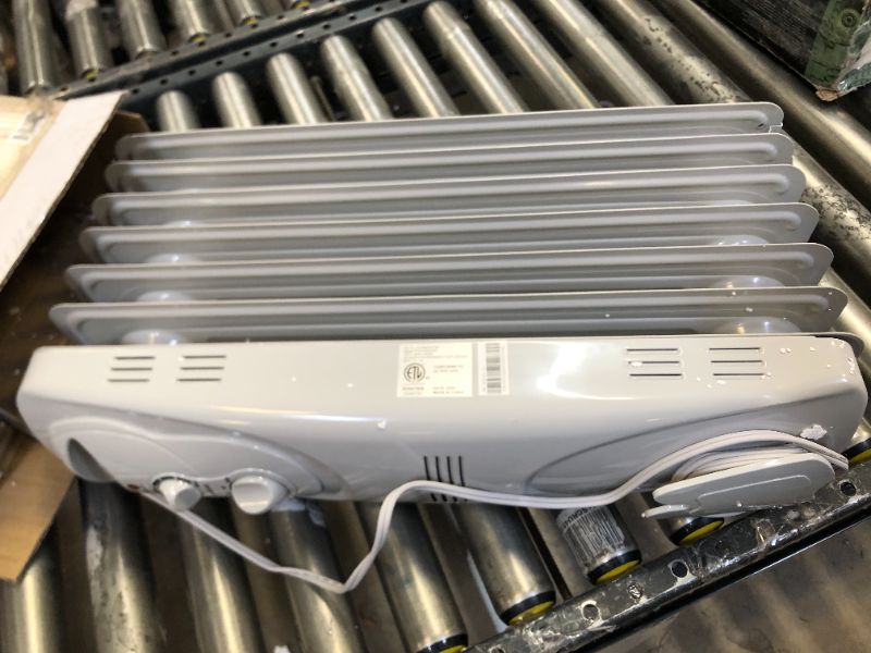 Photo 1 of PELONIS PHO15A2AGW, Basic Electric Oil Filled Radiator, 1500W Portable Full Room Radiant Space Heater with Adjustable Thermostat, White, 26.10 x 14.20 x 11.00 in
