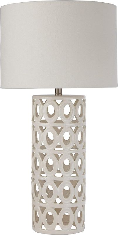 Photo 1 of Amazon Brand – Stone & Beam Ceramic Geometric Cut-Out Table Desk Lamp With LED Light Bulb, 22"H, White
