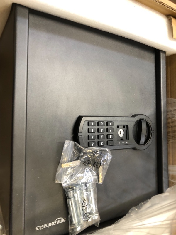 Photo 1 of Amazon Basics Steel Home Security Safe with Programmable Keypad - Secure Documents, Jewelry, Valuables - 1.52 Cubic Feet, 13.8 x 13 x 16.5 Inches, Black
