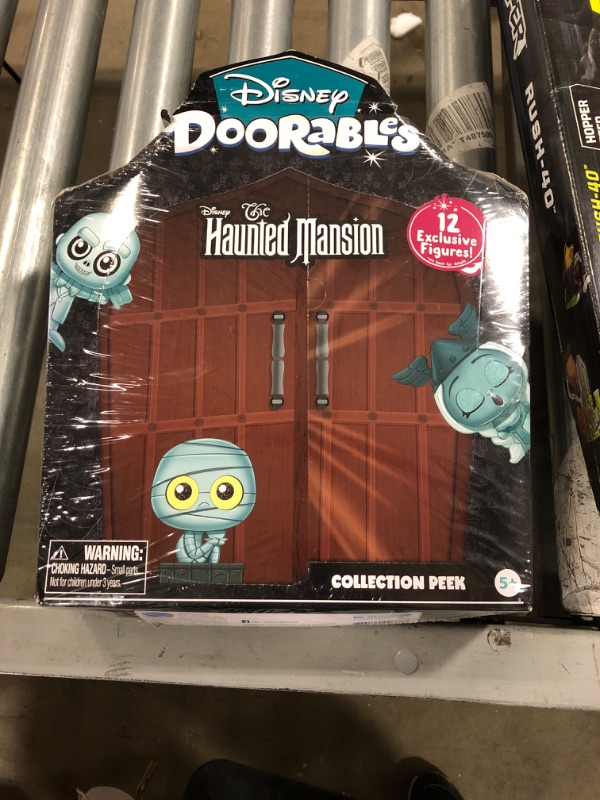 Photo 1 of Disney Doorables The Haunted Mansion Collection Peek, Easter Basket Stuffers, 12 Mini Figures, Styles May Vary, Officially Licensed Kids Toys for Ages 5 Up, Gifts and Presents, Amazon Exclusive