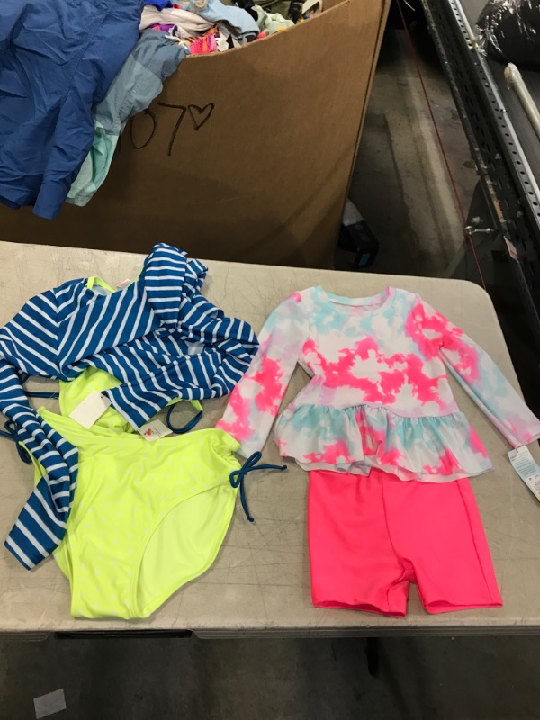 Photo 1 of Little girl's bathing suits both different sizes