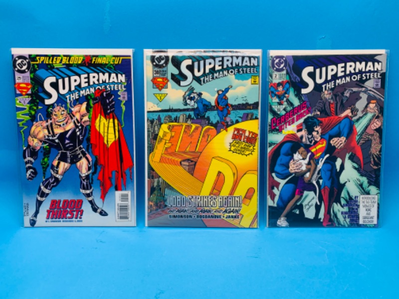 Photo 1 of 892756…3 superman man of steel comics in plastic sleeves