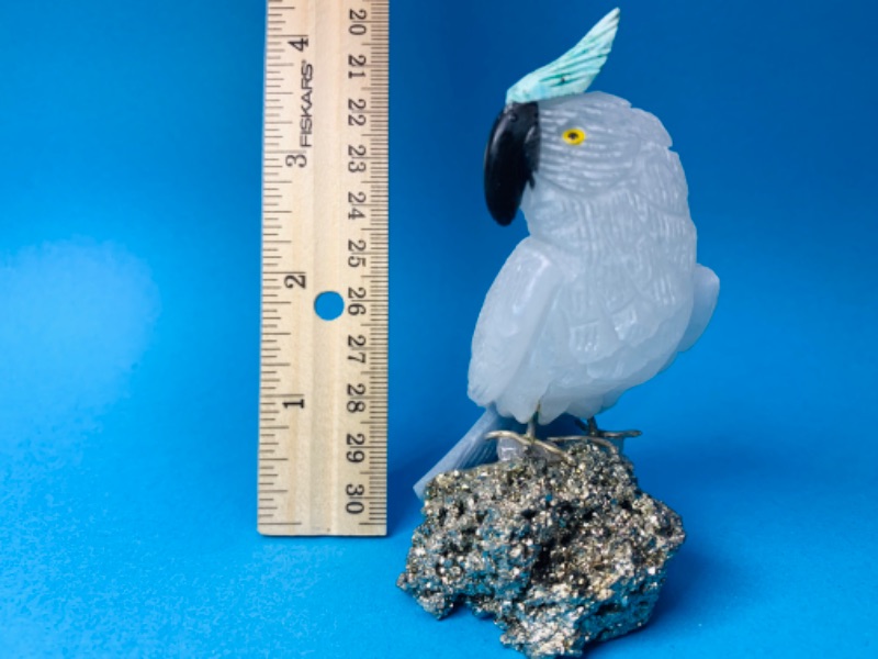 Photo 1 of 893070… carved parrot on pyrite rock