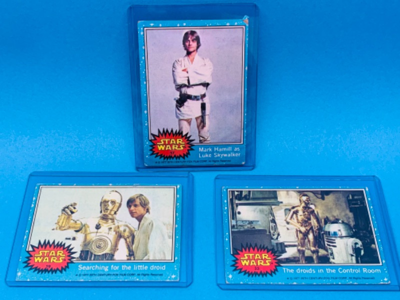 Photo 1 of 893191…3 vintage 1977 Star Wars trading cards in hard plastic sleeves 