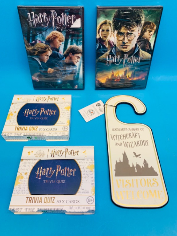 Photo 1 of 893813…Harry Potter DVD’s, door hanger,and trivia 
