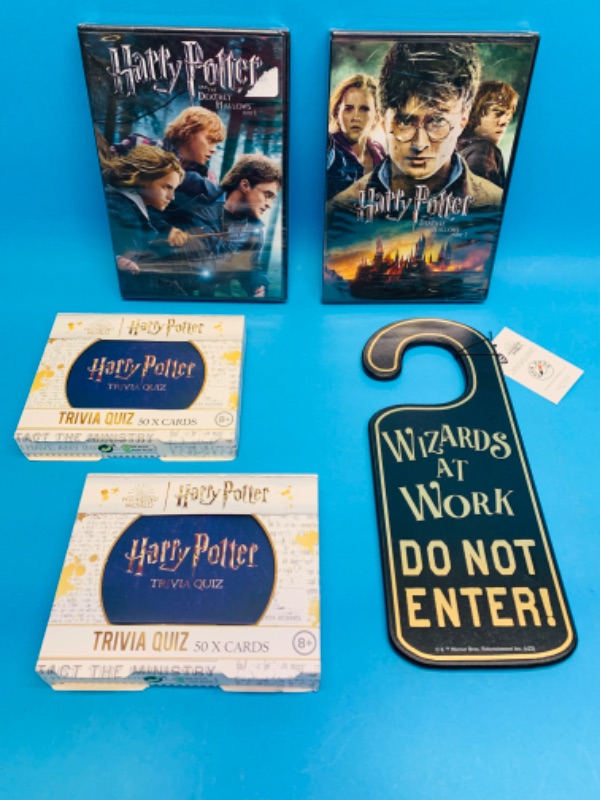 Photo 2 of 893813…Harry Potter DVD’s, door hanger,and trivia 