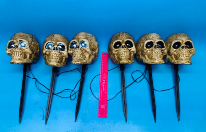 Photo 1 of 894190…6 used skull yard stakes -lights up and sounds