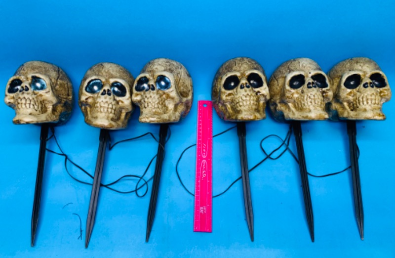 Photo 1 of 894191… 6 used skull yard stakes -lights up and sounds