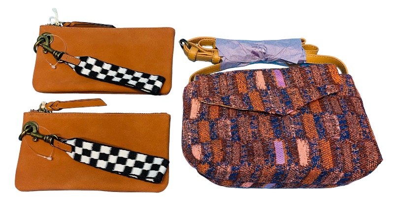Photo 1 of 894290… 2 wristlets and a purse 