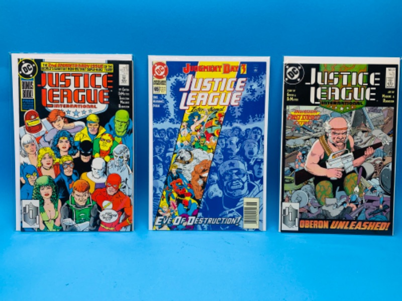 Photo 1 of 894554…3 justice league international comics in plastic sleeves 