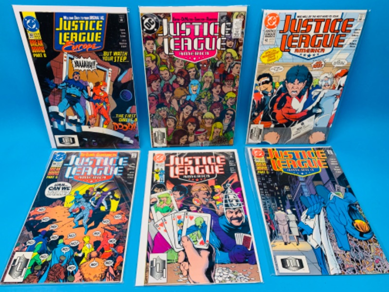 Photo 1 of 894570…6 older justice league  comics in plastic sleeves 