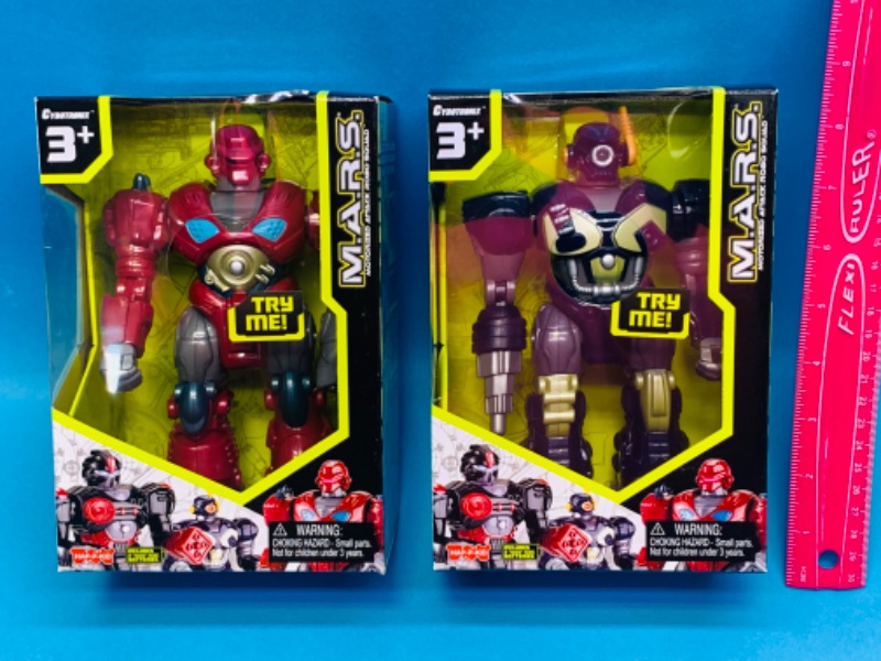 Photo 1 of 894603… 2 motorized attack robo squad toys