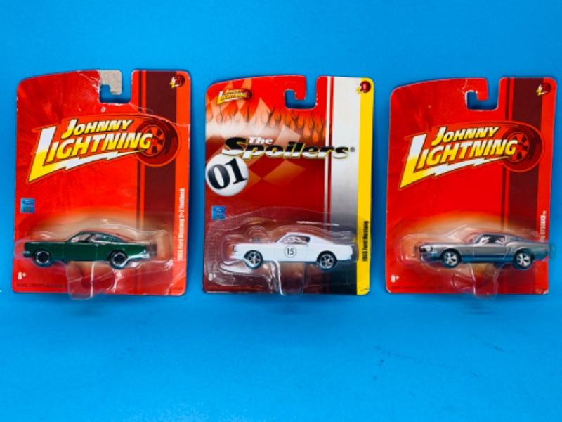 Photo 2 of 894675… 3 Johnny Lightning die cast Ford Mustang cars