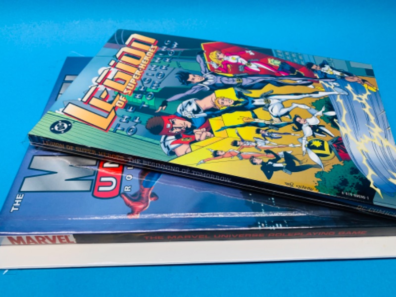 Photo 2 of 894823…hardcover Marvel Universe and softcover Legion books in plastic sleeves 