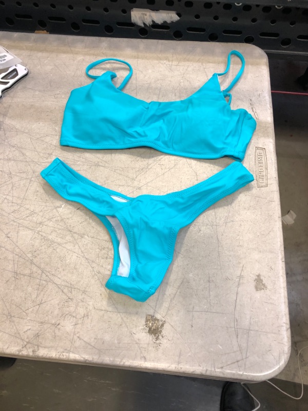 Photo 1 of  LIGHT BLUE TOP AND BRAZILIAN BOTTOMS  SWIM SUIT ( SIZE: MED) 