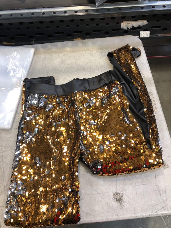 gold and black pants