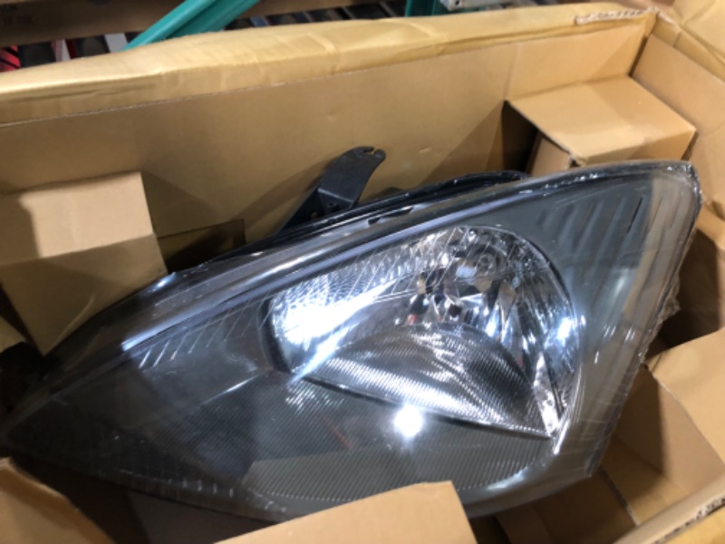 Photo 1 of TYC Left Headlight Assembly Compatible with 2003-2004 Ford Focus
