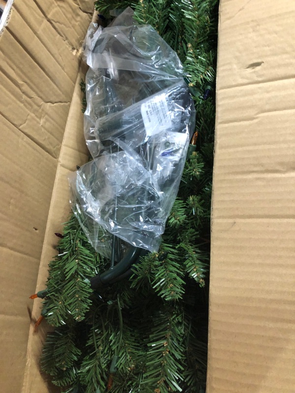 Photo 3 of **MAJOR DAMAGE POWER CORD CUT**
National Tree Company Artificial Pre-Lit Slim Christmas Tree, Green, 6.5 ft