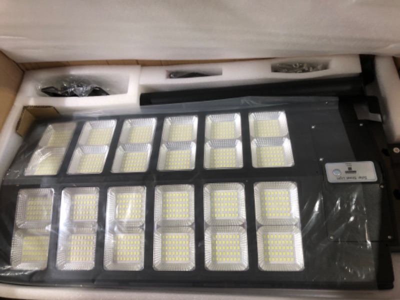 Photo 1 of Deepn 2 Pack Solar Street Light, 3000W 280000 Lumens High Brightness Solar Flood Lights with Motion Sensor Dusk to Dawn, IP66 Waterproof and Wide Angle Lighting
