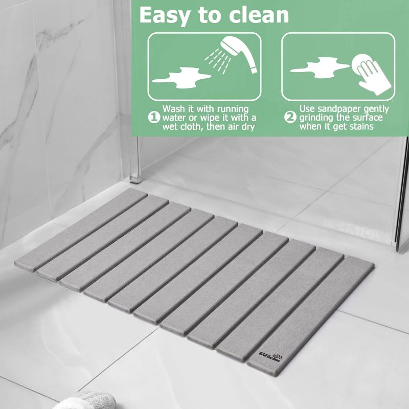 Photo 1 of (READ NOTES) Treselm 2PC Rollable Stone Bath Mat, Diatomaceous Earth Bath Mat, Anti-Slip, Super Absorbent & Quick Drying Mat for Shower, Sink & Kitchen (15x23, Grey)