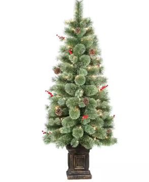 Photo 1 of ***LIGHTS DONT WORK****Pre-Lit 4.5 ft. Green Potted Natural Pine Artificial Christmas Tree with 70-Lights