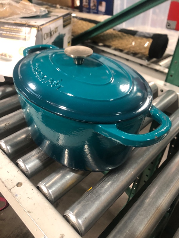 Photo 4 of **SEE NOTES/DAMAGED**
Crock-Pot Artisan Oval Enameled Cast Iron Dutch Oven, 7-Quart, Teal Ombre Teal Ombre 