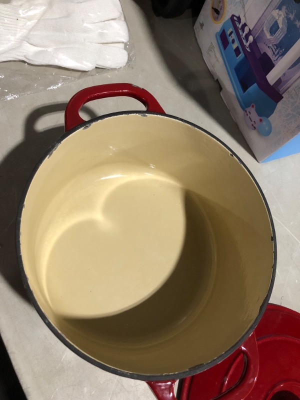 Photo 2 of ***DAMAGED - PAINT CHIPPED - SEE PICTURES***
Lodge 6.5 Quart Enameled Cast Iron Dutch Oven with Lid – Dual Handles Red