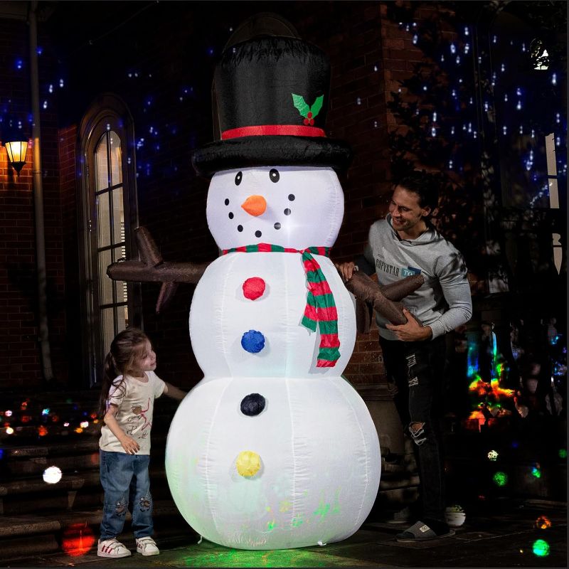 Photo 1 of **SIMILAR TO STOCK PHOTO*** Elegear Christmas Inflatables Outdoor Decorations, 8FT Giant Inflatable Snowman with Rotating RGB LED Lights Christmas Blow Up Yard Decorations for Xmas Party Indoor Outdoor Decoration 8FT Inflatable Snowman