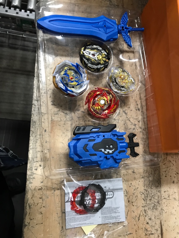 Photo 1 of 4 pack of beyblades 