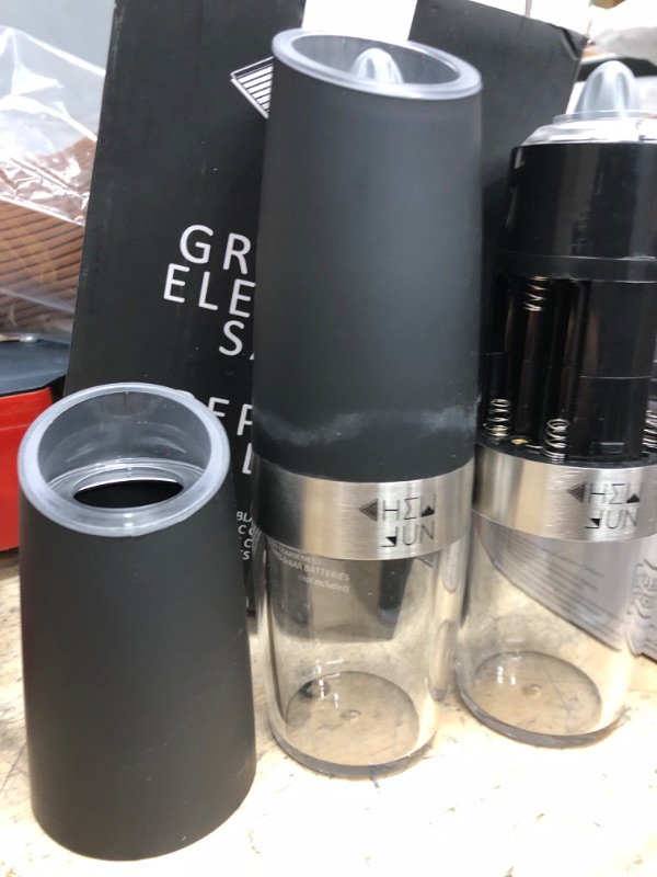 Photo 2 of **EACH MILL REQUIRES 6 AAA BATTERIES**
Electric Gravity Salt and Pepper Grinder Set with Adjustable Coarseness Automatic Pepper and Salt Mill Battery Powered with Blue LED Light,One Hand Operated,Brushed Stainless Steel by CHEW FUN Black Set