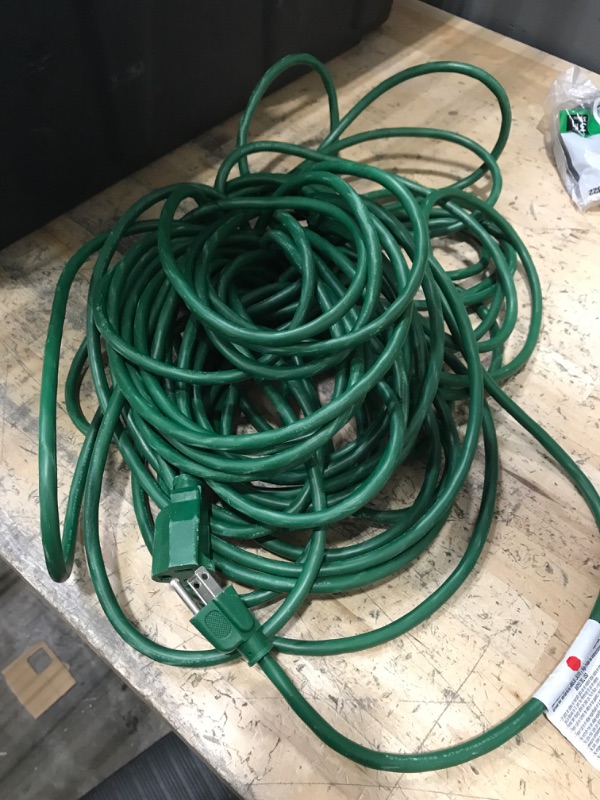 Photo 1 of Green outdoor extension cord - unknown length 