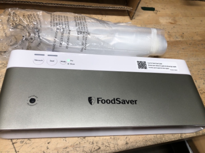 Photo 2 of FoodSaver Compact Vacuum Sealer Machine with Sealer Bags and Roll for Airtight Food Storage and Sous Vide, White White Sealing Machine