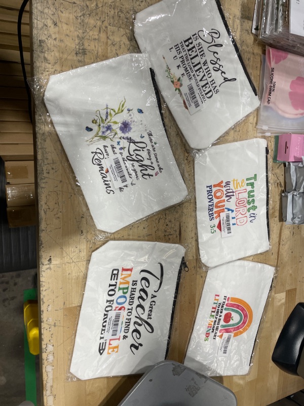 Photo 1 of 5 different makeup/ pouch bags 