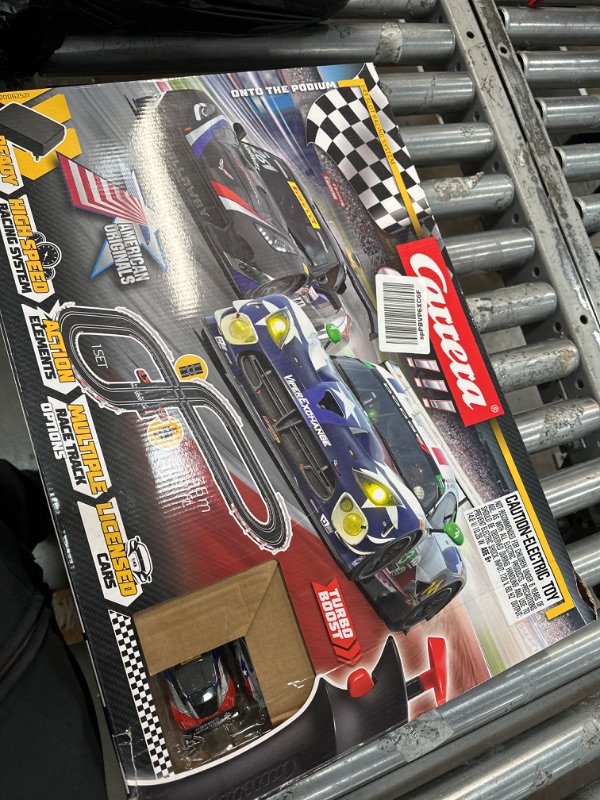 Photo 1 of Carrera GO!!! 62521 onto The Podium Electric Powered Slot Car Racing Kids Toy Race Track Set Includes 2 Hand Controllers and 2 Cars in 1:43 Scale