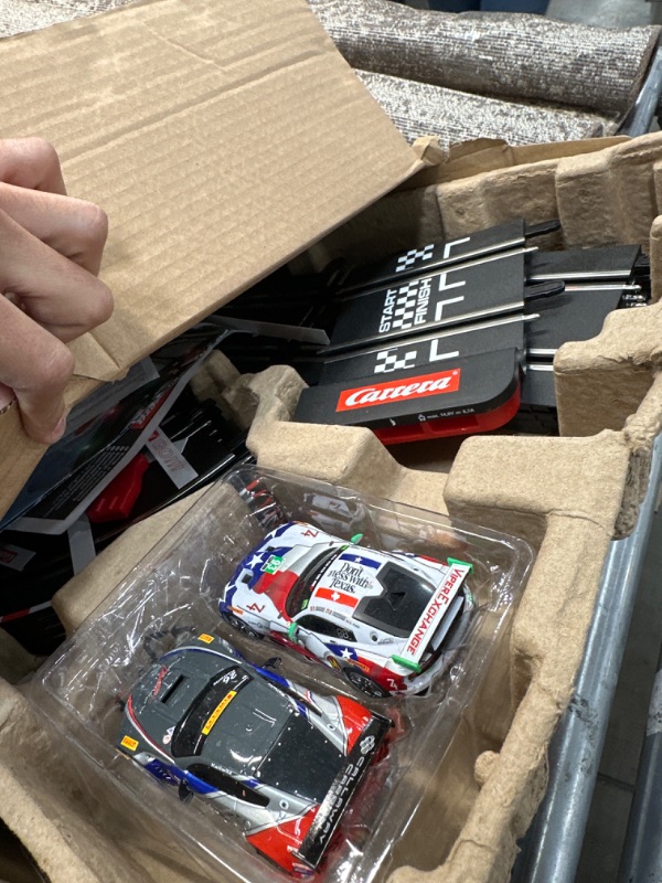 Photo 1 of Carrera GO!!! 62521 onto The Podium Electric Powered Slot Car Racing Kids Toy Race Track Set Includes 2 Hand Controllers and 2 Cars in 1:43 Scale