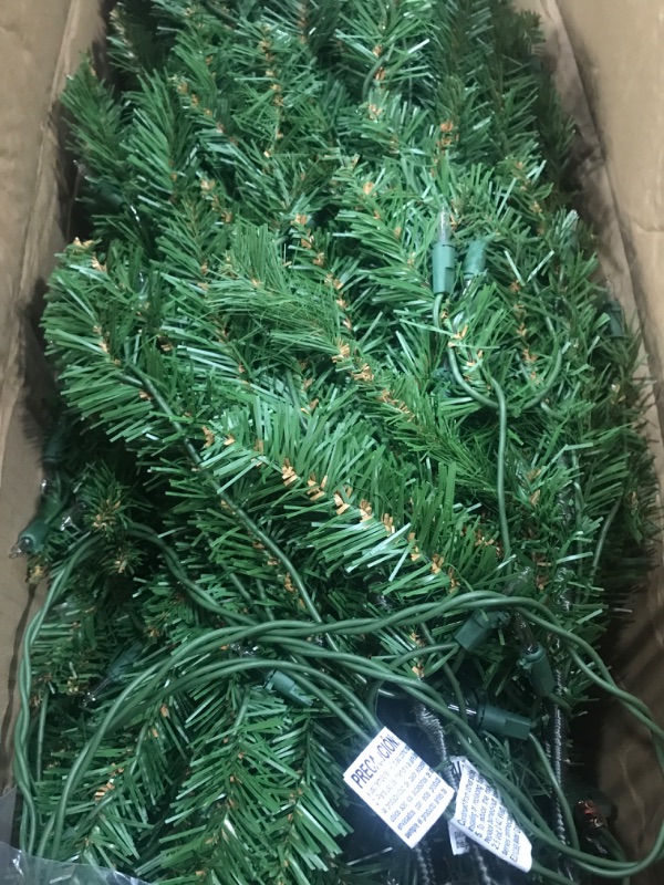 Photo 2 of ***NOT FUNCTIONAL - LIGHTS DON'T WORK***
National Tree Company Artificial Pre-Lit Slim Christmas Tree, Green, Kingswood Fir, White Lights, Includes Stand, 6.5 Feet