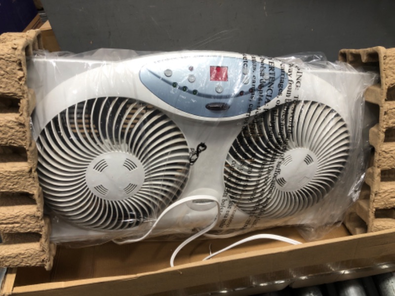 Photo 2 of * Broken * Bionaire Window Fan with Twin 8.5-Inch Reversible Airflow Blades and Remote Control, White White 2 Blades Electronic control with LCD screen Window Fan