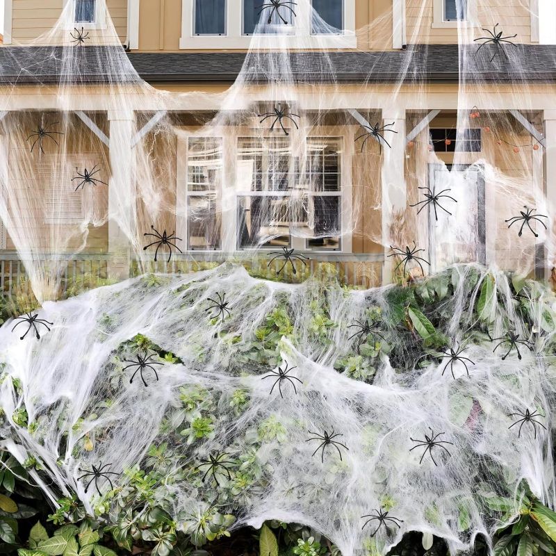 Photo 1 of 900 sqft Spider Webs Halloween Decorations Bonus with 30 Fake Spiders, Super Stretch Cobwebs for Halloween Indoor and Outdoor Party Supplies
