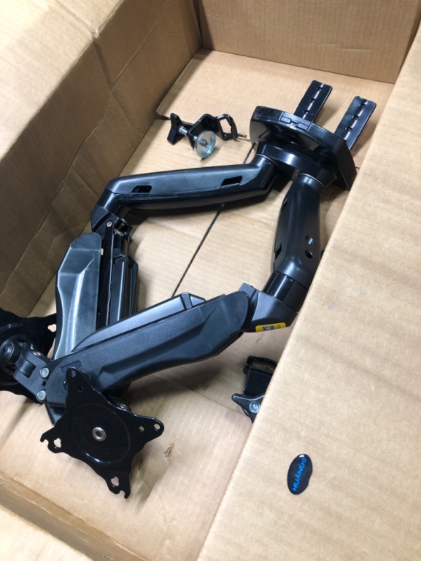 Photo 1 of HUANUO Dual Monitor Stand - Adjustable Spring Monitor Desk Mount Swivel Vesa Bracket with C Clamp