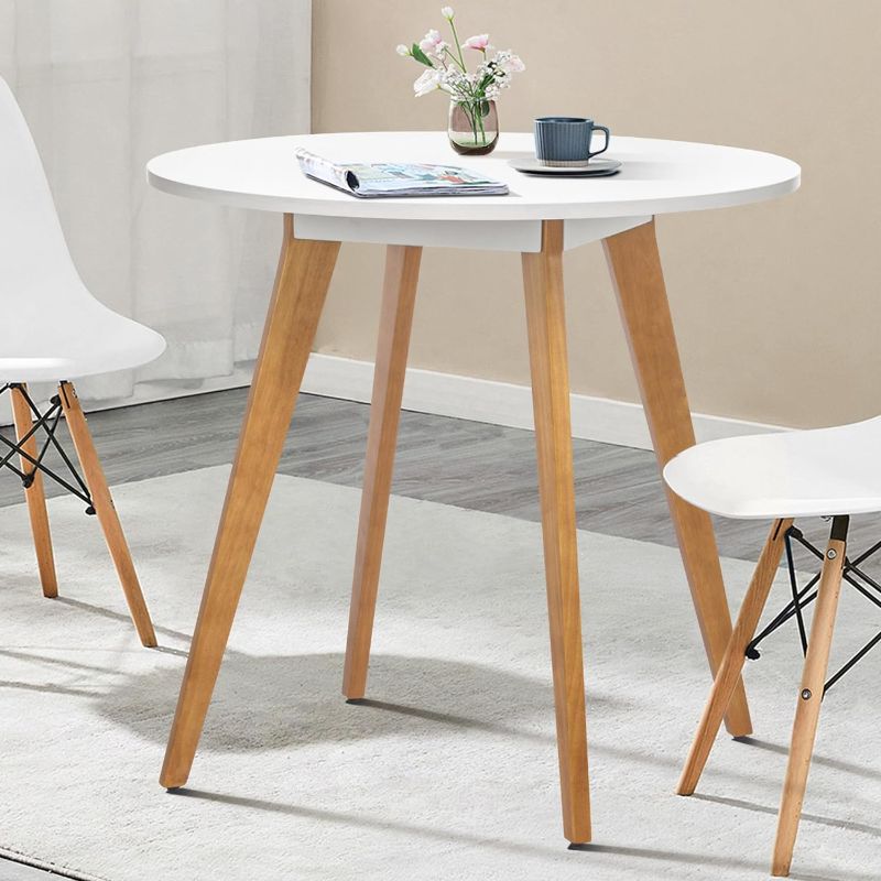 Photo 1 of 
Comfy to go 31.5" Round Dining Table for 2-4 Person- Small Kitchen Table with Solid Wood Legs Modern Table for Dining Room, Kitchen, Leisure Cafe(White) Table Only
