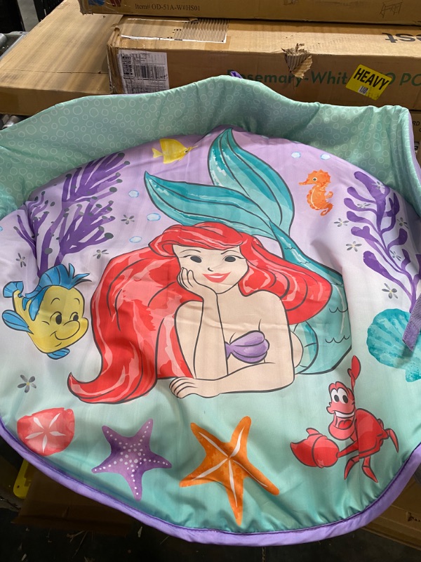 Photo 4 of Bright Starts The Little Mermaid Twinkle Trove Light-Up Musical Baby Activity Gym with Tummy Time Pillow, Newborn+