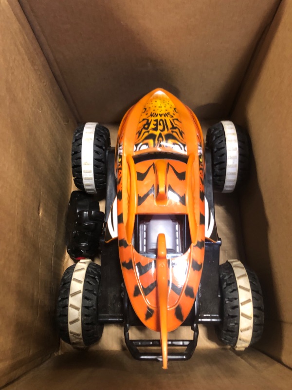 Photo 3 of Hot Wheels Monster Trucks, Remote Control Car, Monster Truck Toy with All-Terrain Wheels, 1:15 Scale Unstoppable Tiger Shark RC