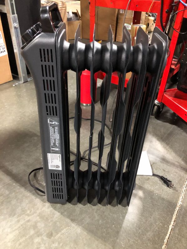 Photo 5 of Amazon Basics Portable Radiator Heater with 7 Wavy Fins, Manual Control, Black, 1500W