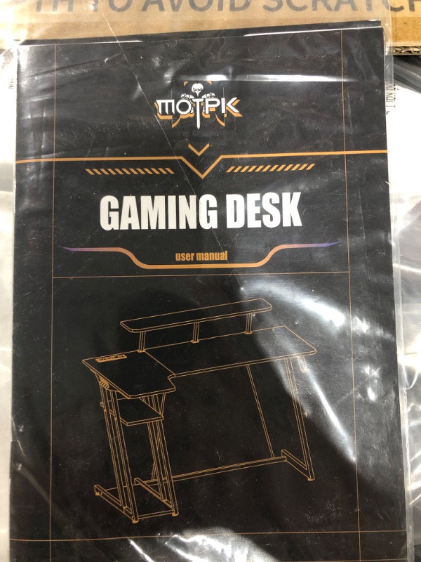 Photo 3 of MOTPK L Shaped Gaming Desk with LED Lights & Power Outlets, Gaming Computer Desk 47inch with Storage Shelf, Corner Desk with Carbon Fiber Texture, Gamer Desk Gaming Table, Black